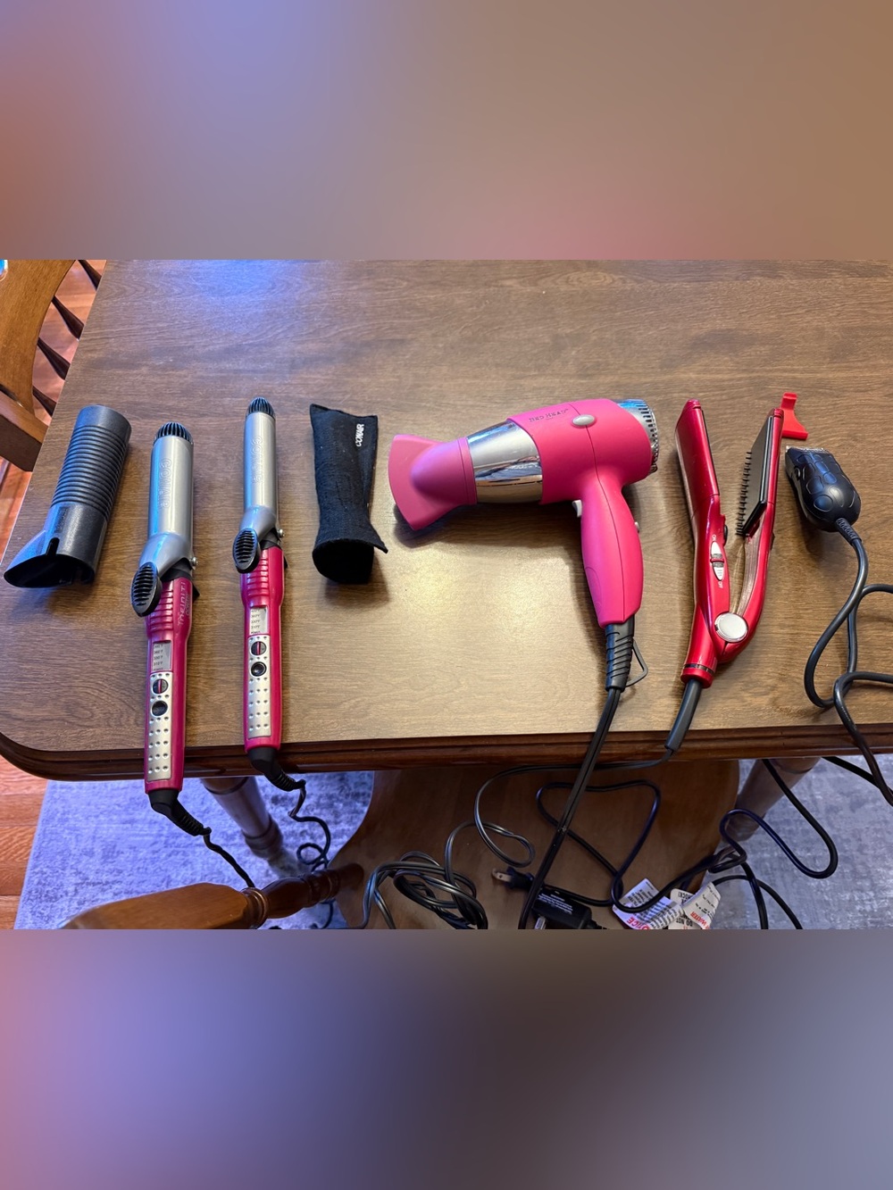 Lot of hair tools - curling irons, blow dryer, straightener, and mini clipper
